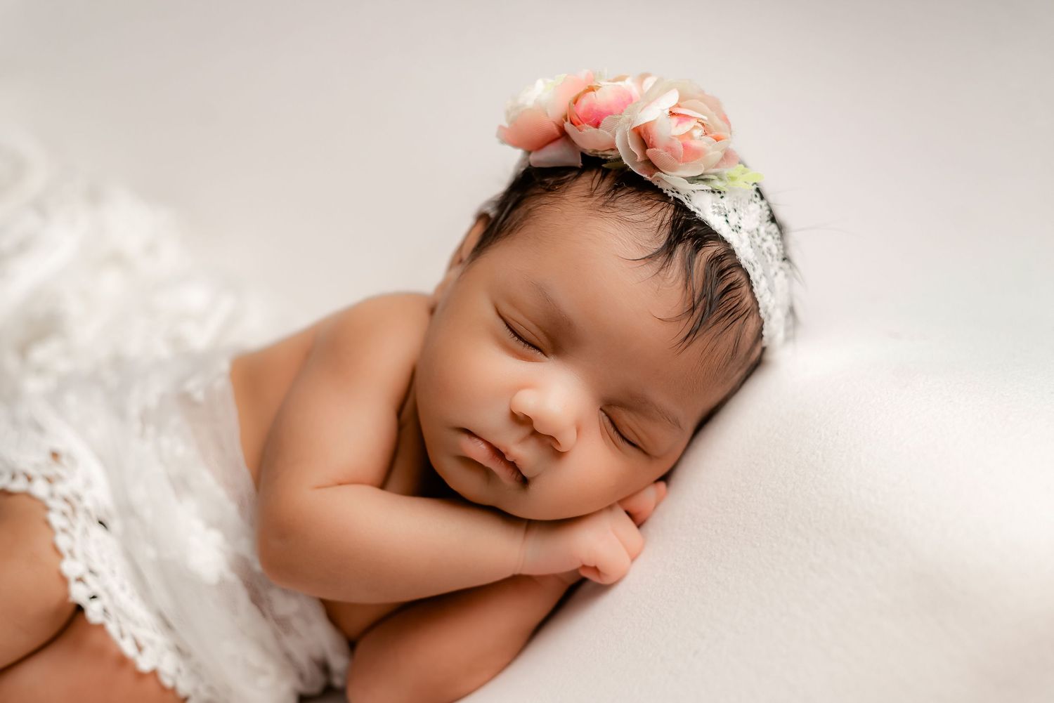 Newborn baby sleeping  during newborn session in Fulshear TX