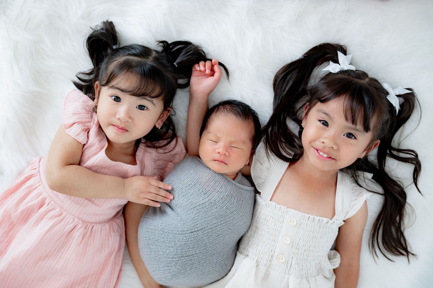 Sibling image with newborn during a studio newborn session in Houston, TX