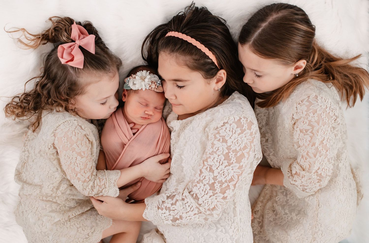 Siblings snuggle newborn session in Fulshear TX