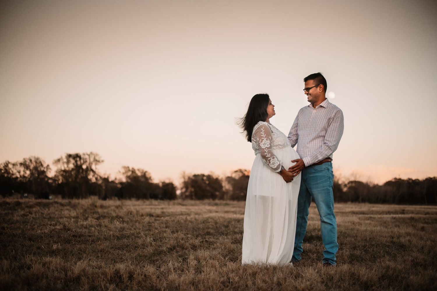 Outdoor maternity session in Katy, TX with expecting couple.