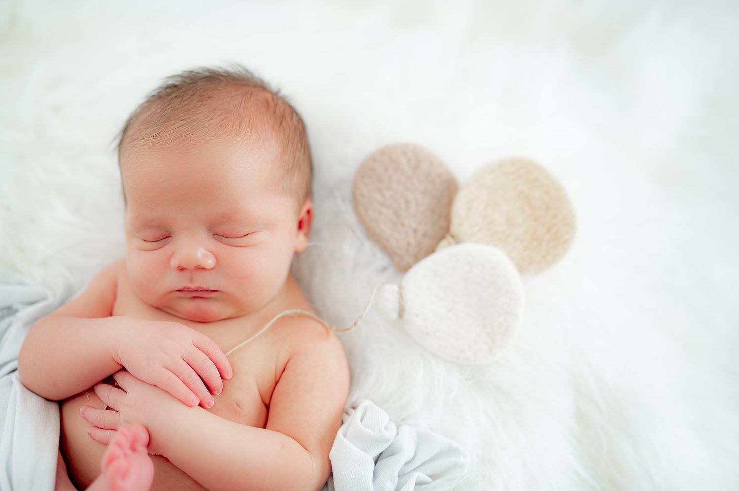 Studio newborn session with sleeping baby.