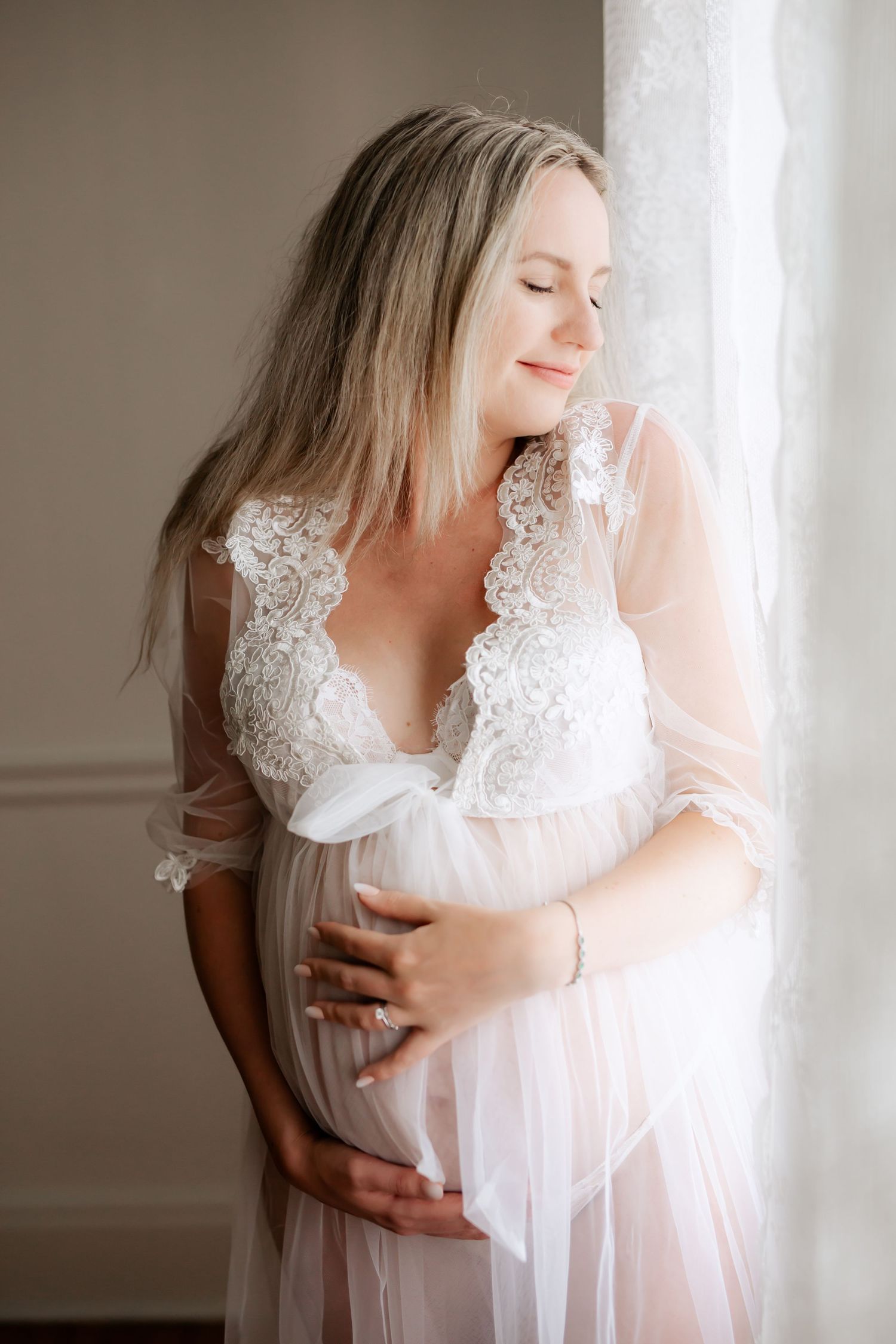 Grimsby Photographer. In studio boudoir maternity session. Bright and airy.