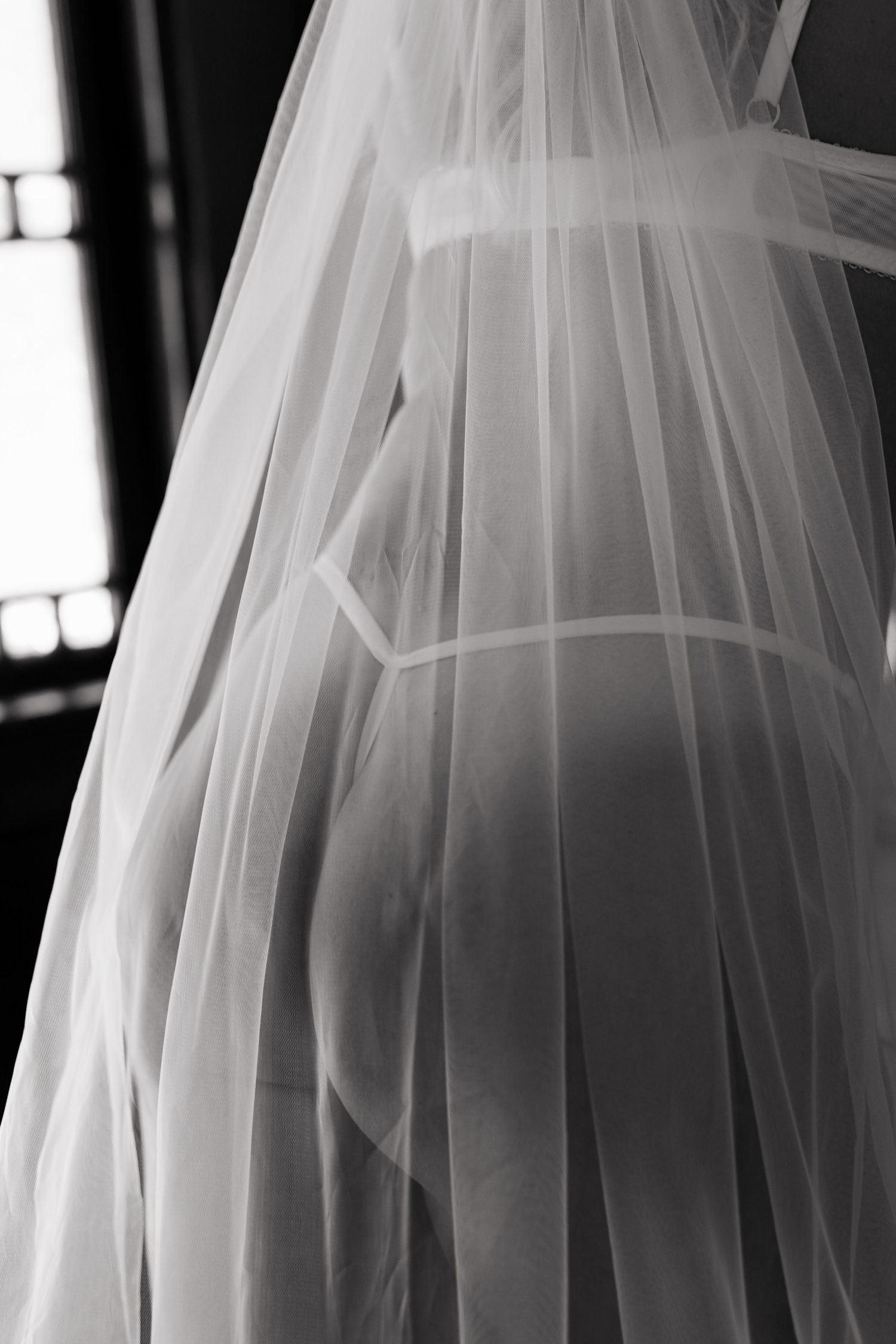 Grimsby Photographer. In studio boudoir photo session. Moody black & white. Bridal Boudoir
