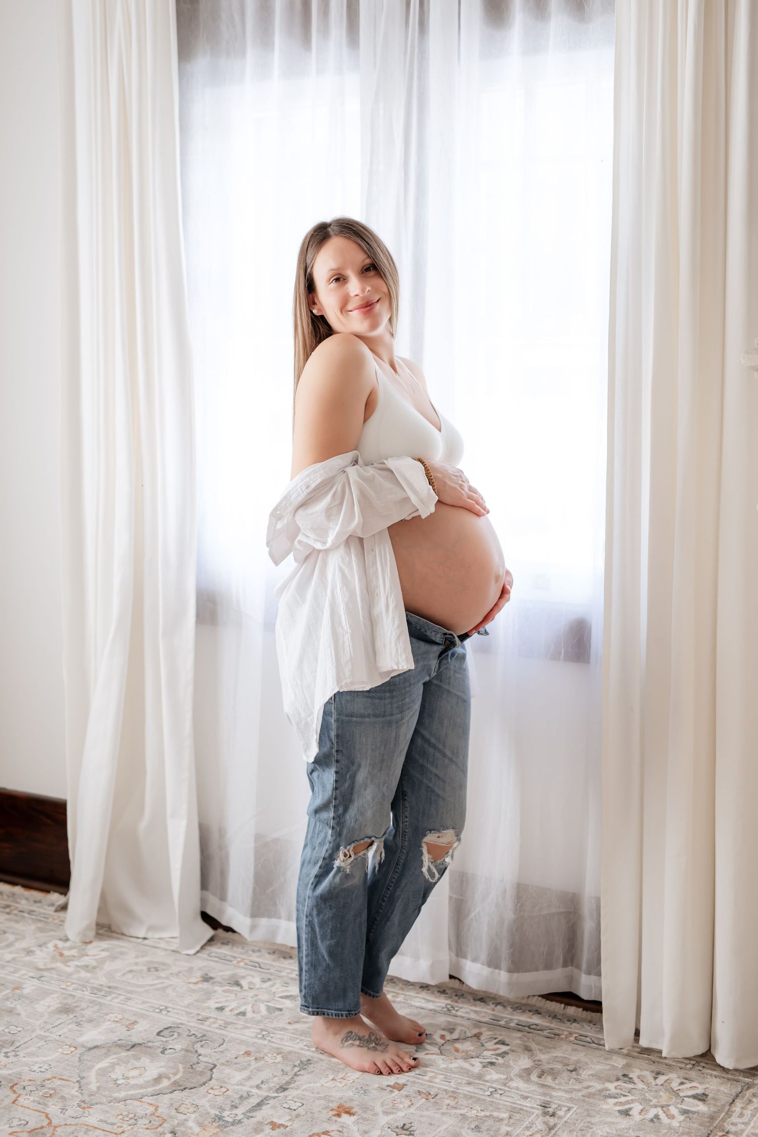 Grimsby Photographer. In studio boudoir maternity session. Bright and airy.