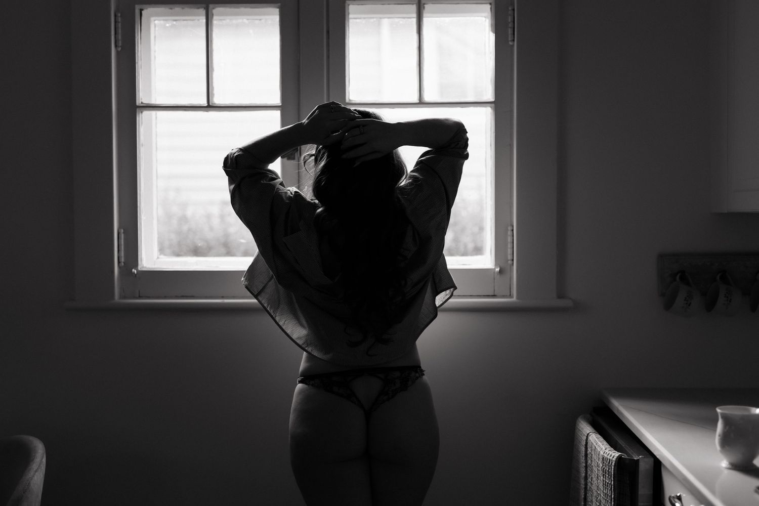 Grimsby Photographer. In studio boudoir photo session. Moody black & white.