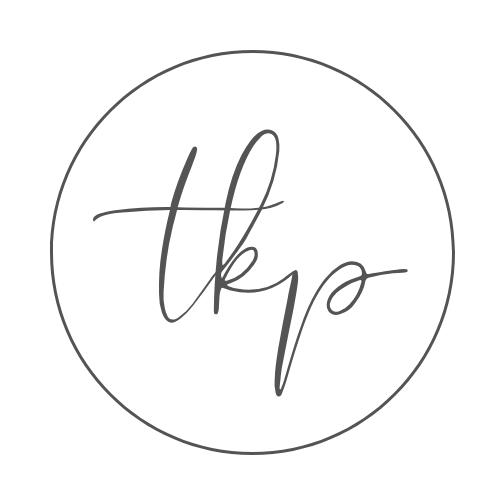 Simple black handwritten circles and lines on white paper forming a minimalist abstract pattern.