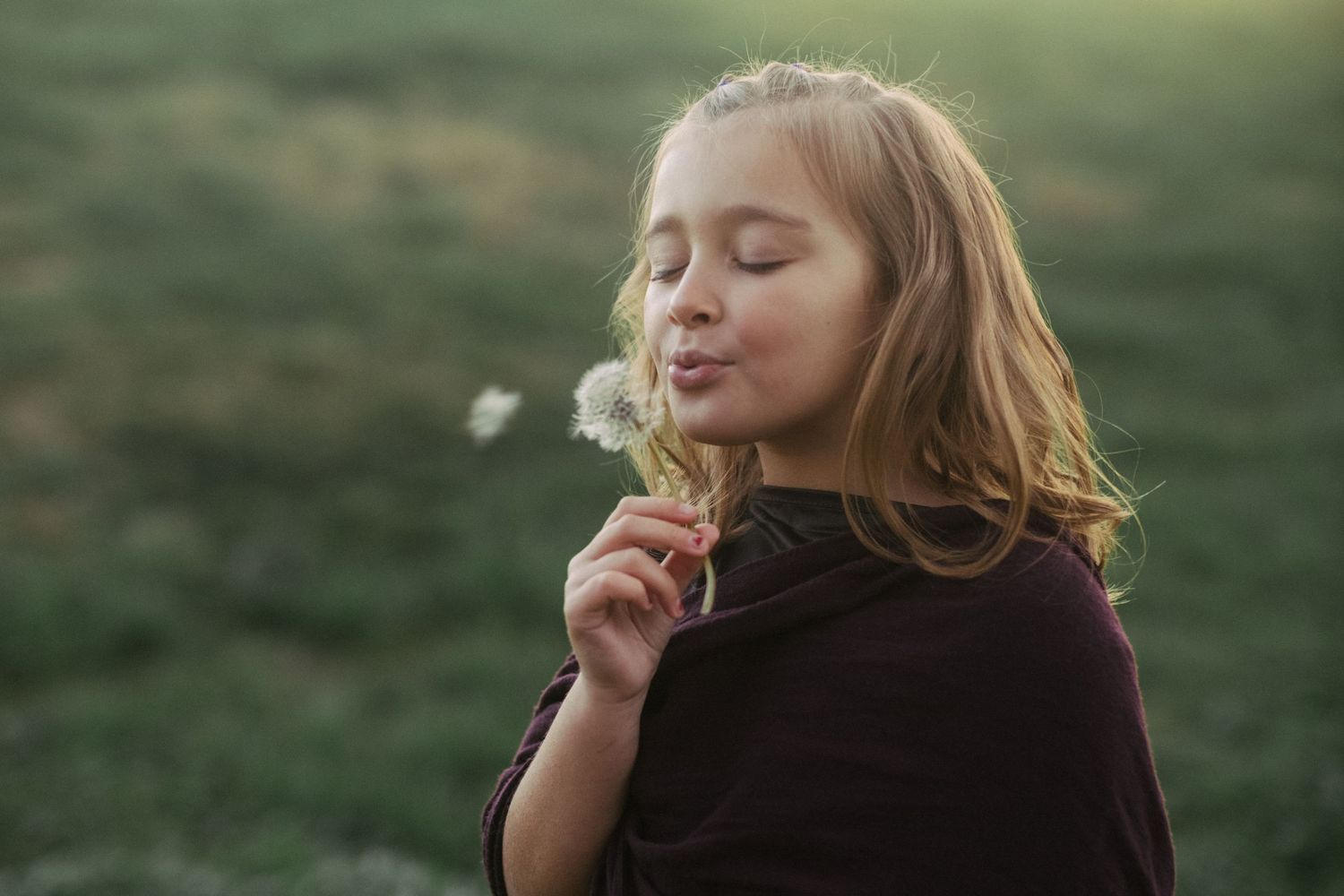 A tranquil sunset photoshoot shows thoughtful poses in natural lighting.