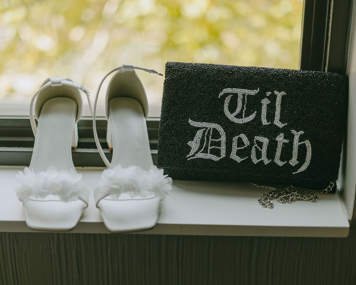 A wedding photo with 'Til Death' text displayed in gothic lettering against a dark background.