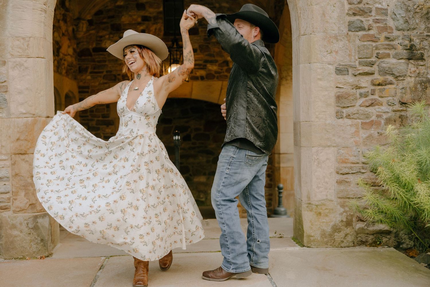 Dancing under stone archways with vintage architectural details.