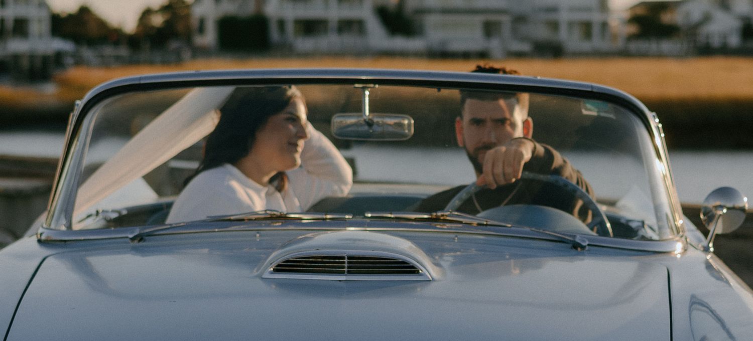 A series of side-by-side images showing people sitting in cars, captured through windshields at dusk.