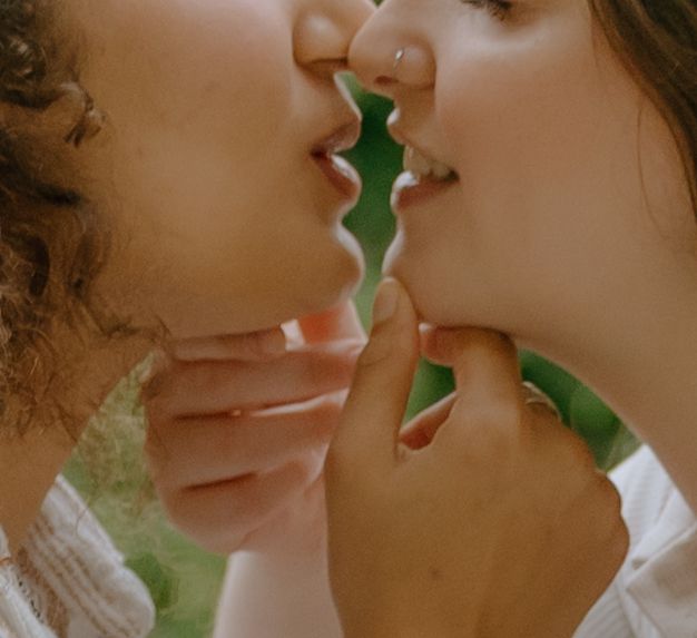 Intimate artistic close-up photo showing two people almost kissing.