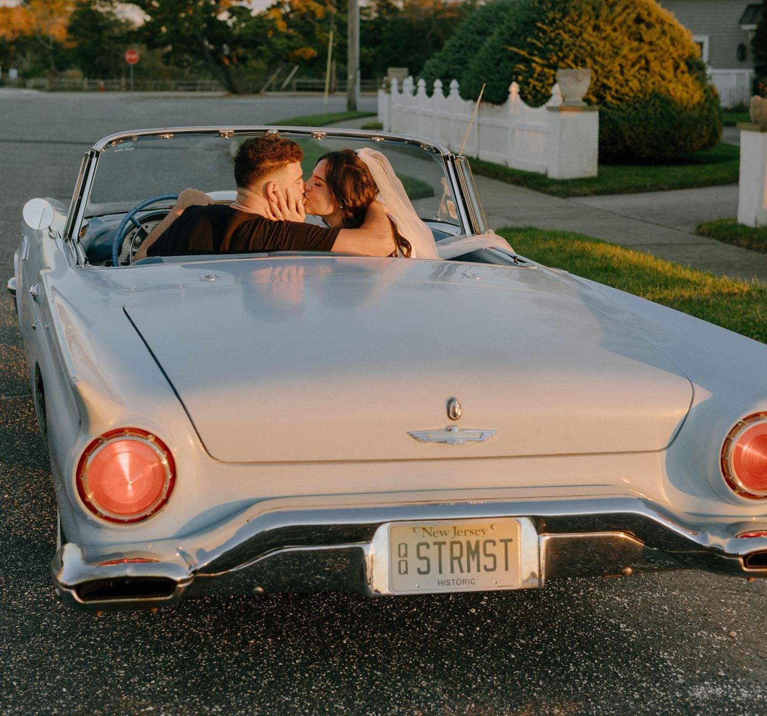 Classic white vintage car photographed from multiple angles showing retro details.