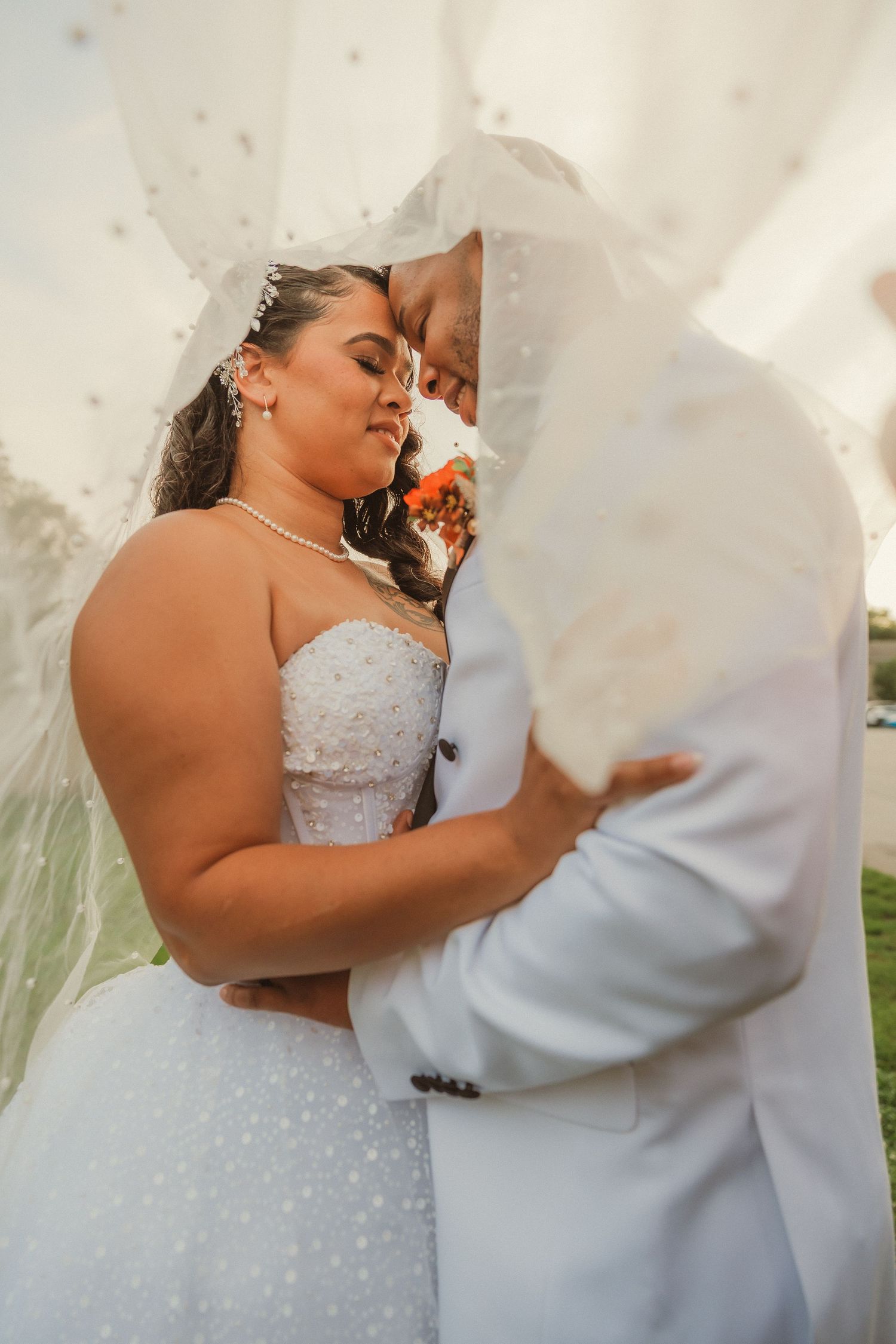 Candid wedding photos showing intimate moments between a couple in white formal attire.