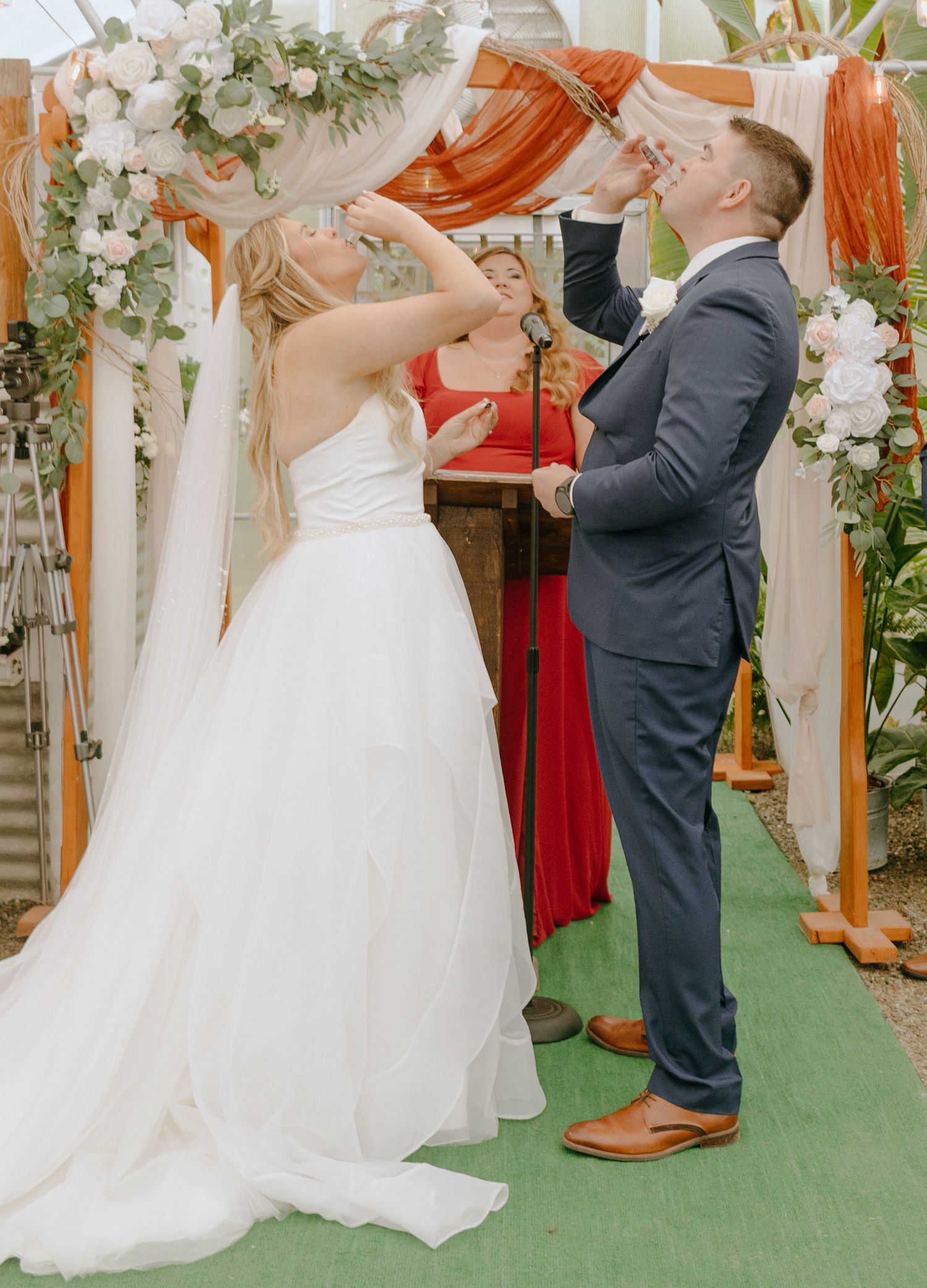 A sequence of wedding dance photos showing joyful moments on a green floor with floral decorations.