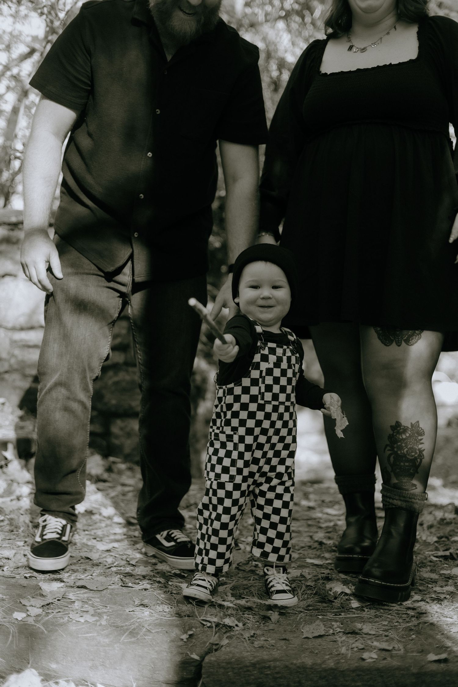 Four sequential black and white photos show legs walking through mud or dirt in a vintage style.