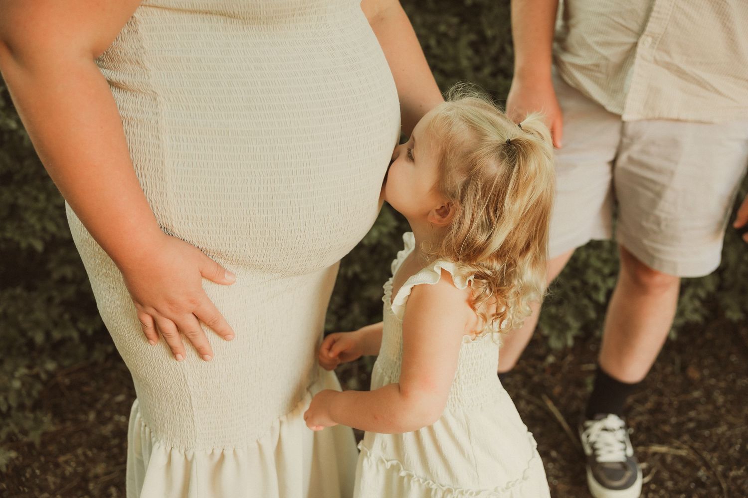 Detail shots of coordinated cream-colored outfits in outdoor setting.