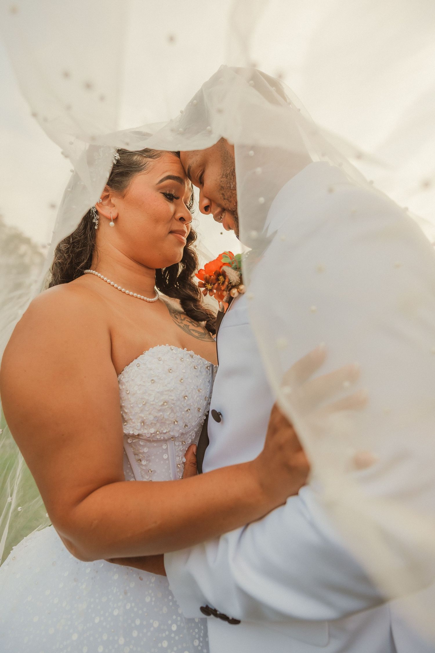 Intimate wedding portrait sequence showing romantic couple embrace.