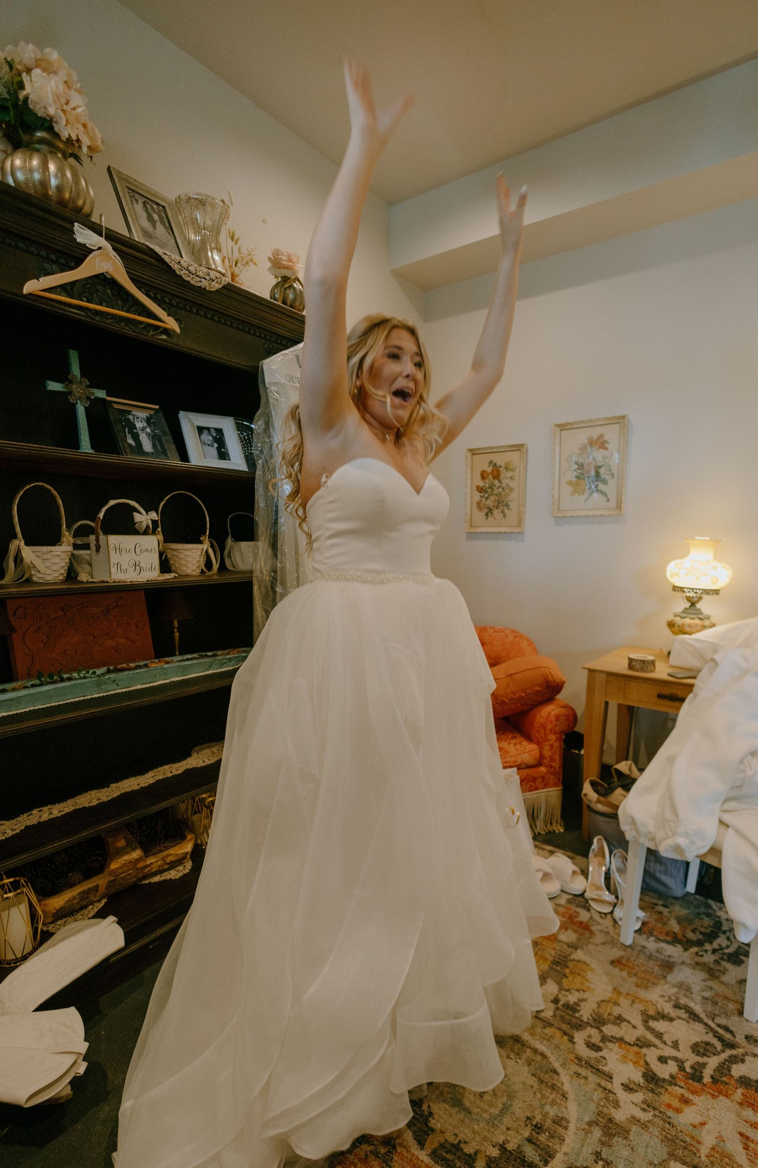 A joyful scene in a room with a piano as a white wedding dress twirls in celebration.
