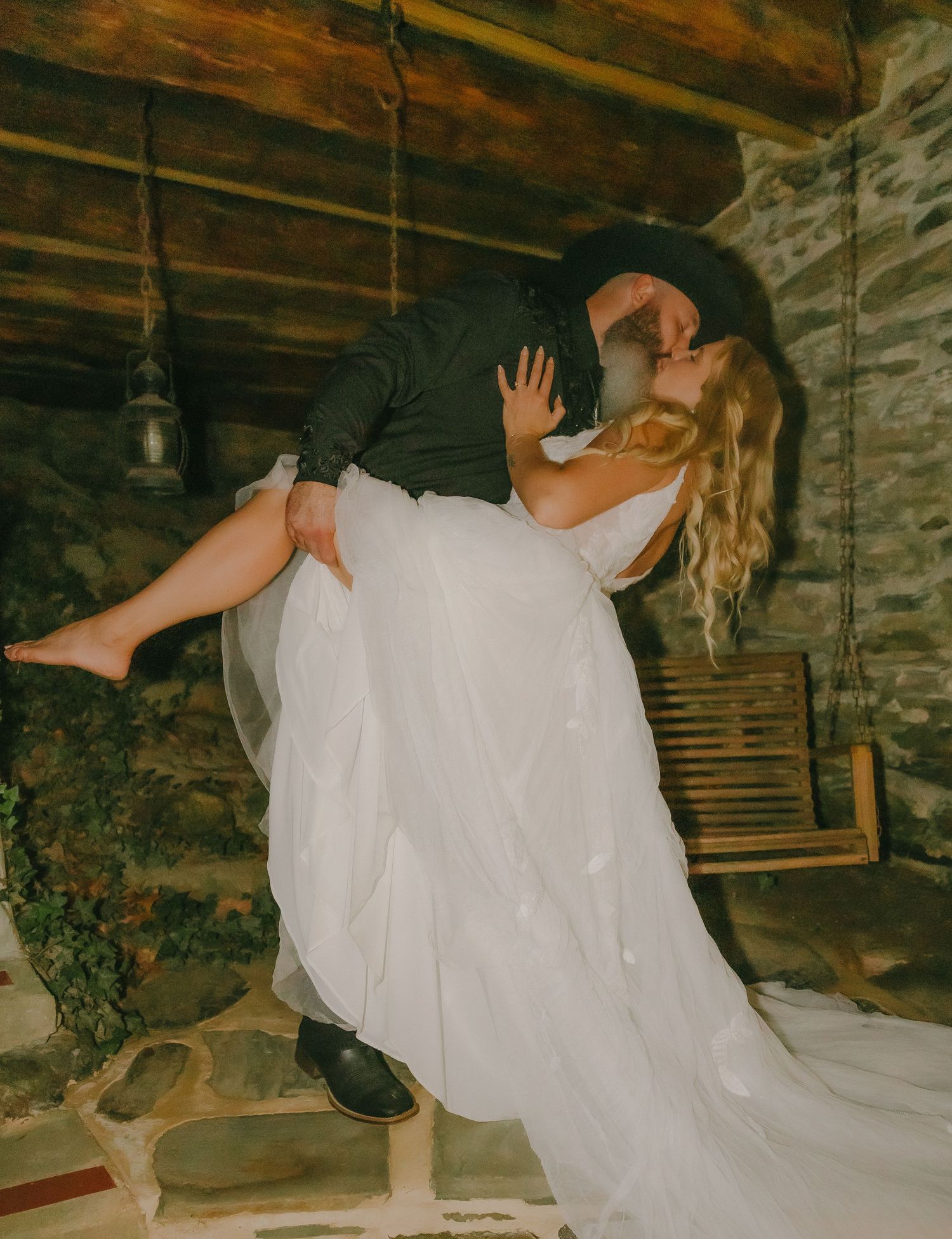 A series of candid wedding moments in a rustic stone cellar setting.