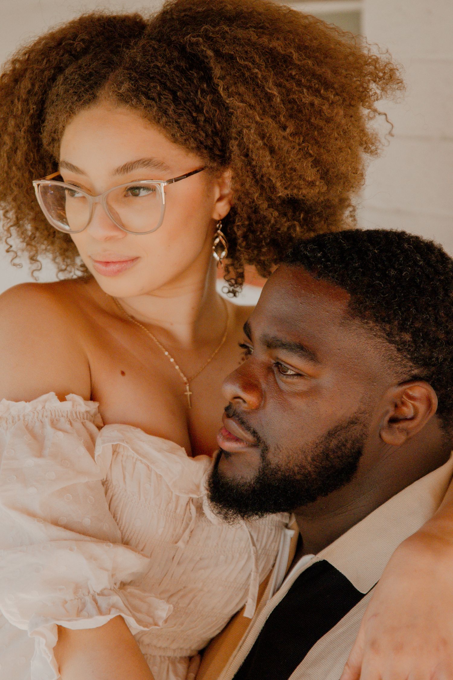 Intimate couple portrait with warm lighting and soft focus.