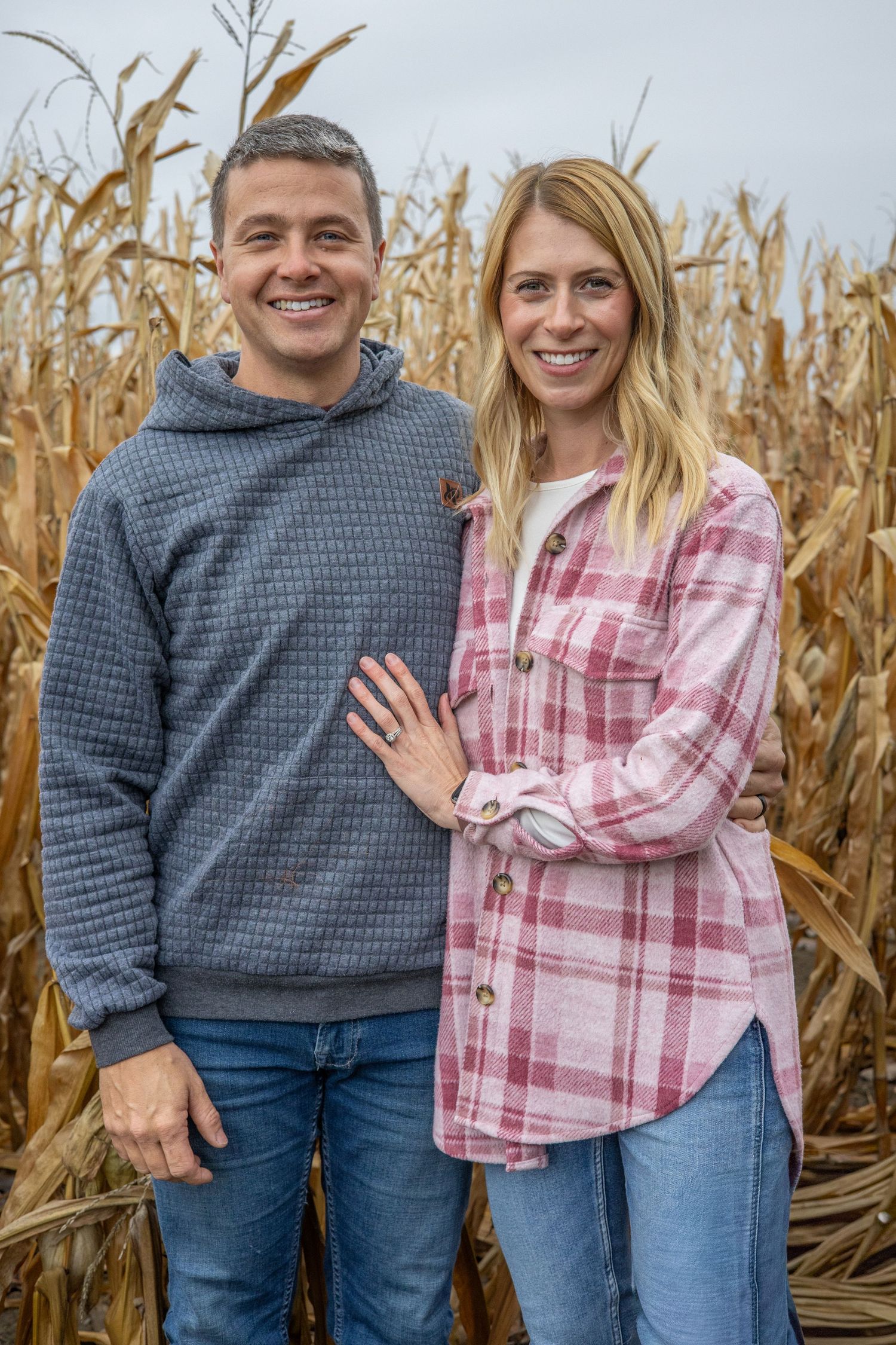 Couple smiling in corn field during a Family session