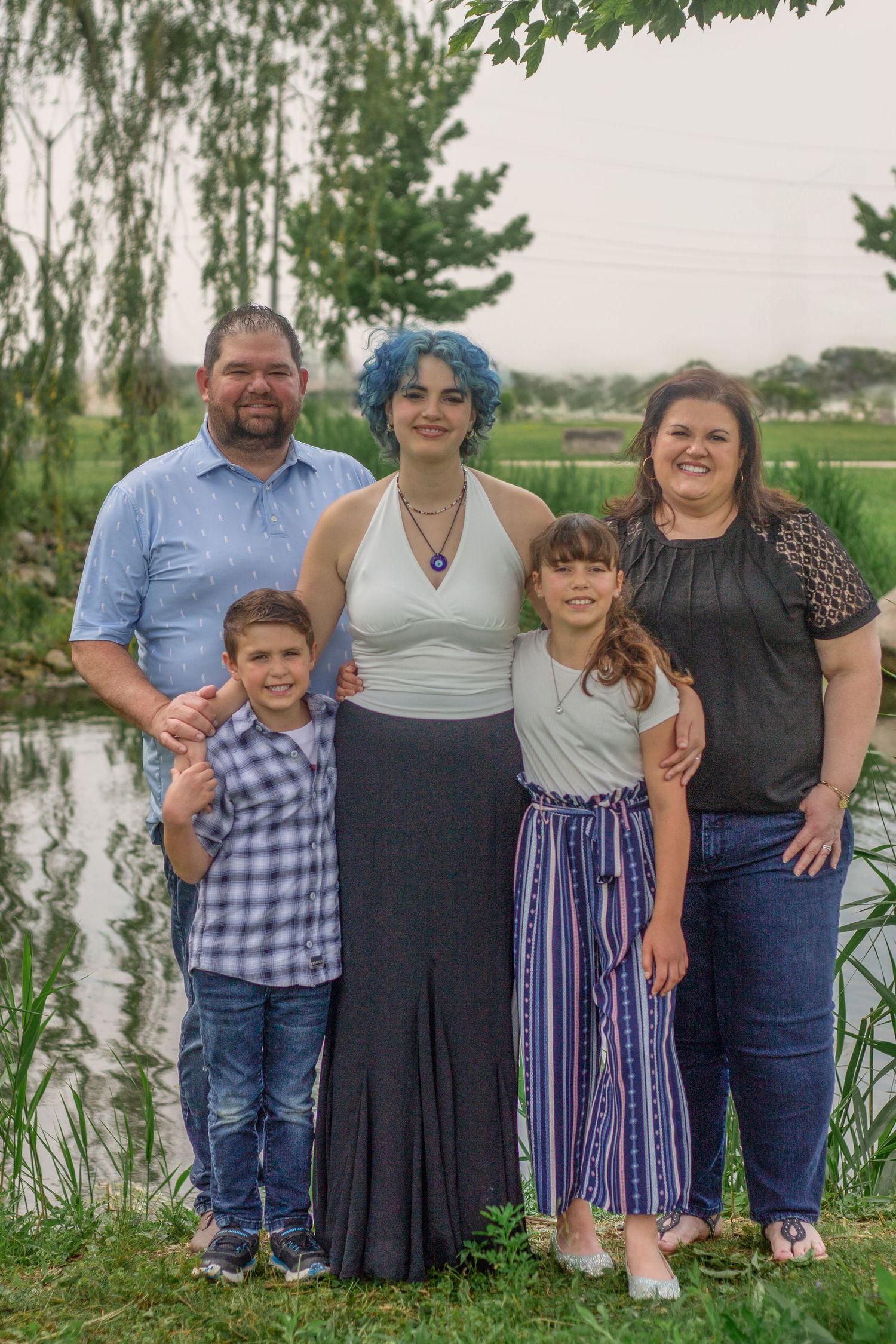 Family smiling at Belle River Marina during a Family session