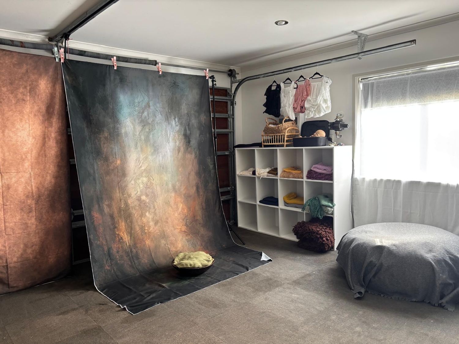 Large photography studio space with various backdrops and lighting equipment at Gabriella Aranky Photography studio, Auckland.