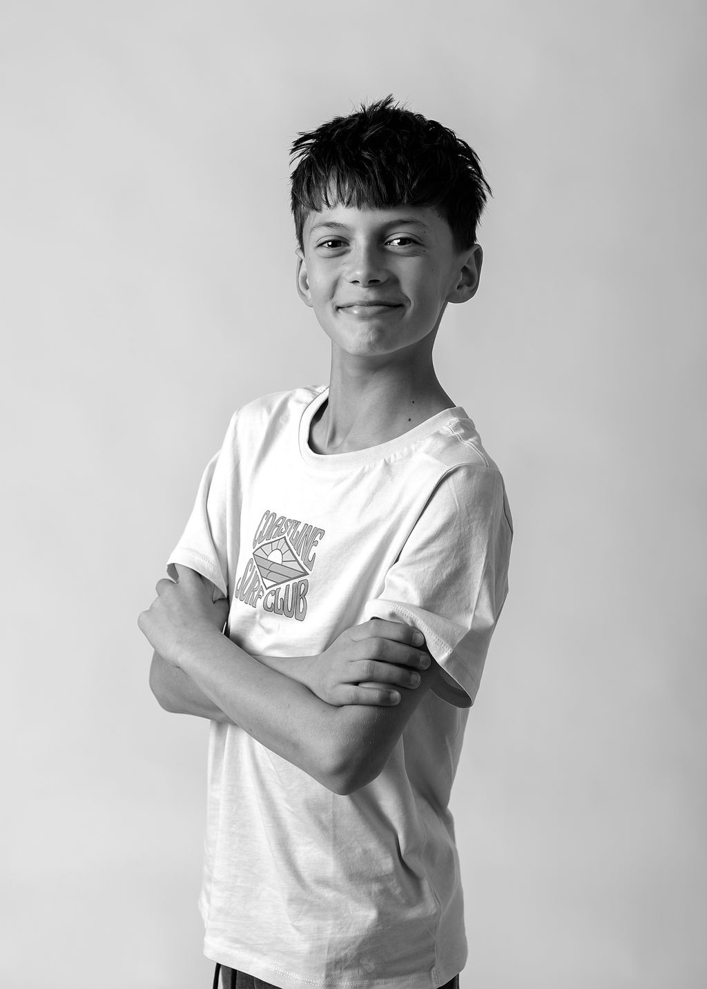 Black and white portraits showing expressive poses in white t-shirt at Gabriella Aranky Photography studio, Auckland.