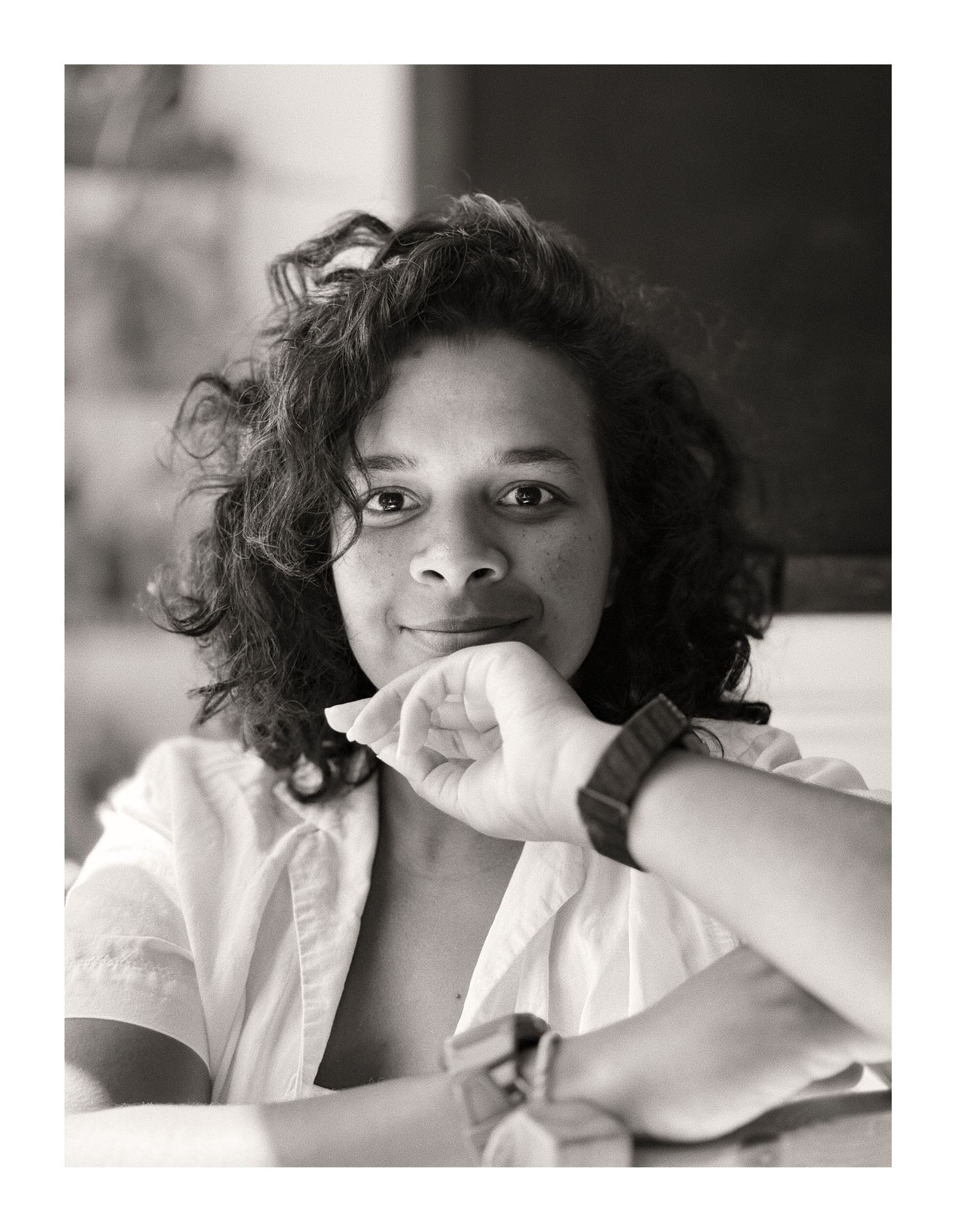 Black and white portrait series showing artistic angles and expressions in a white shirt.
