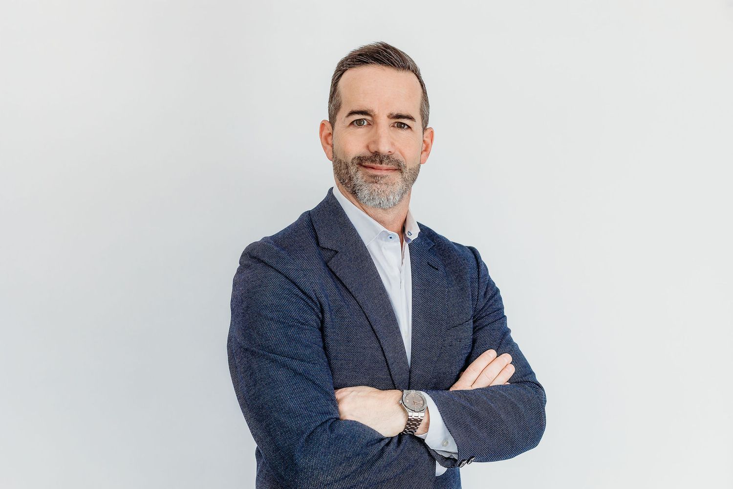 Professional headshots of people in business attire against clean white backgrounds.