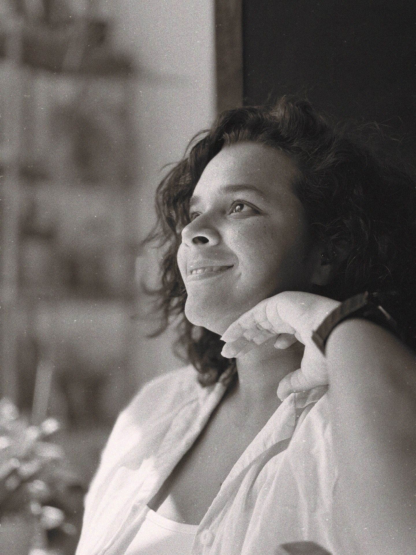 Artistic black and white portrait series with dramatic shadows and lighting.