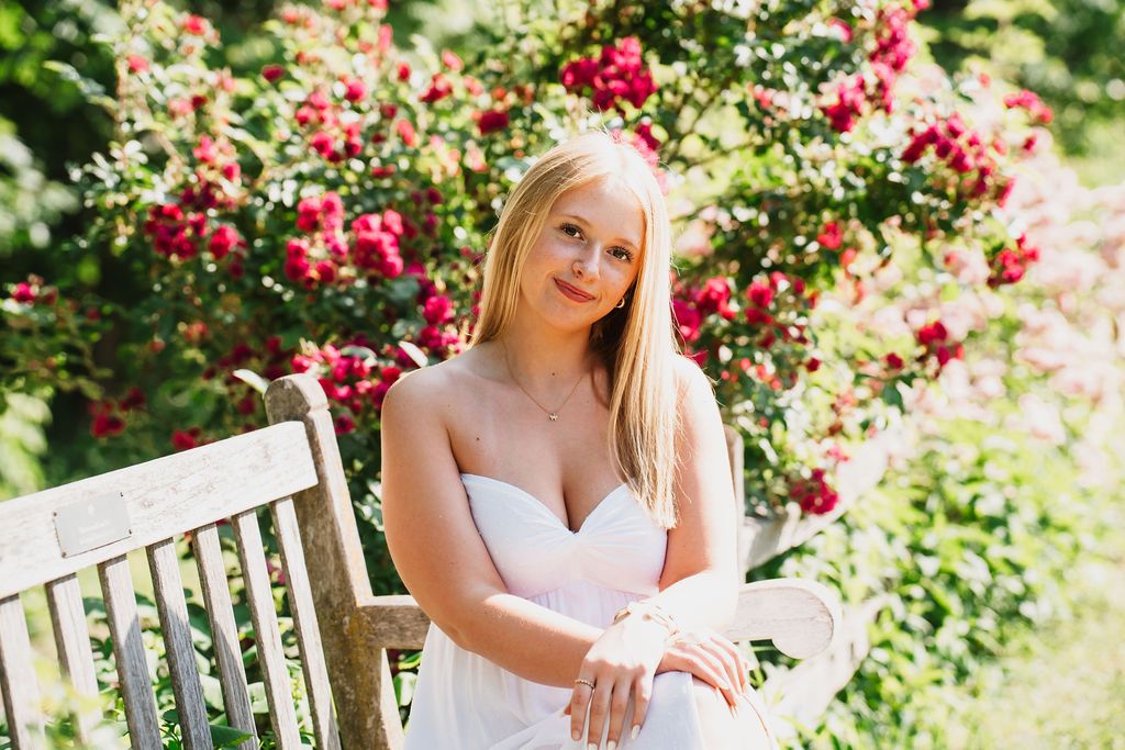 Garden portrait with vibrant red roses and natural greenery.