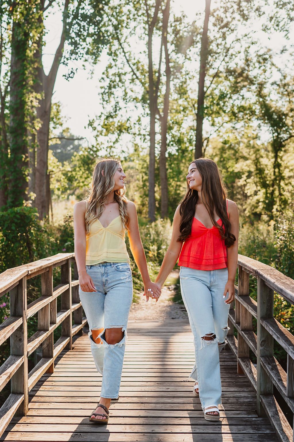 Collection of casual photos showing someone walking and posing on a wooden footbridge in nature.