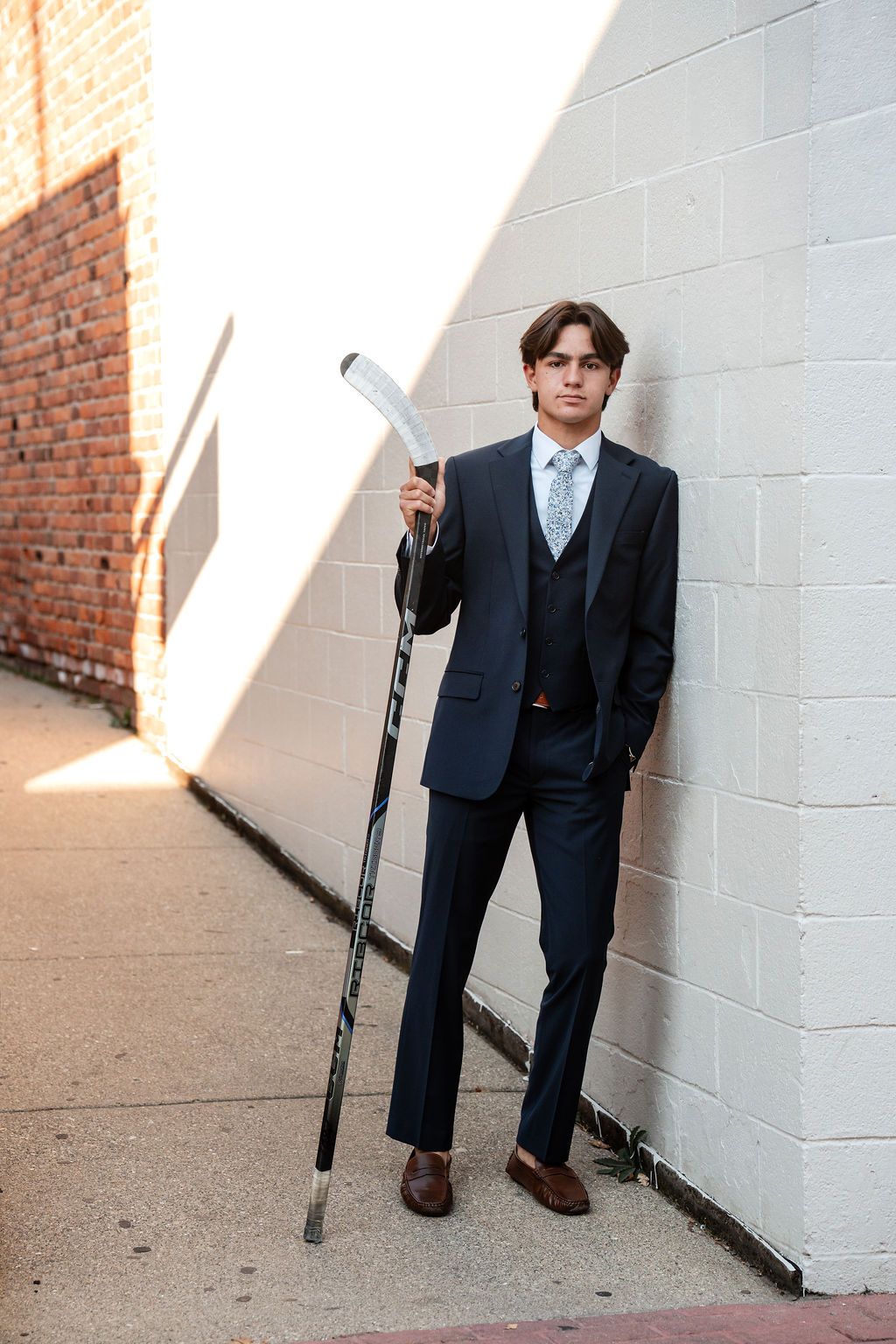 Senior photos in Plymouth, Michigan for a Churchill high school hockey player.