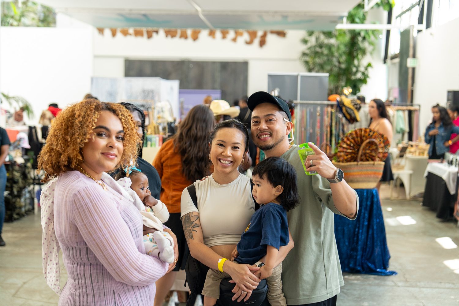 Groups mingle and socialize at a community gathering with festive decorations.