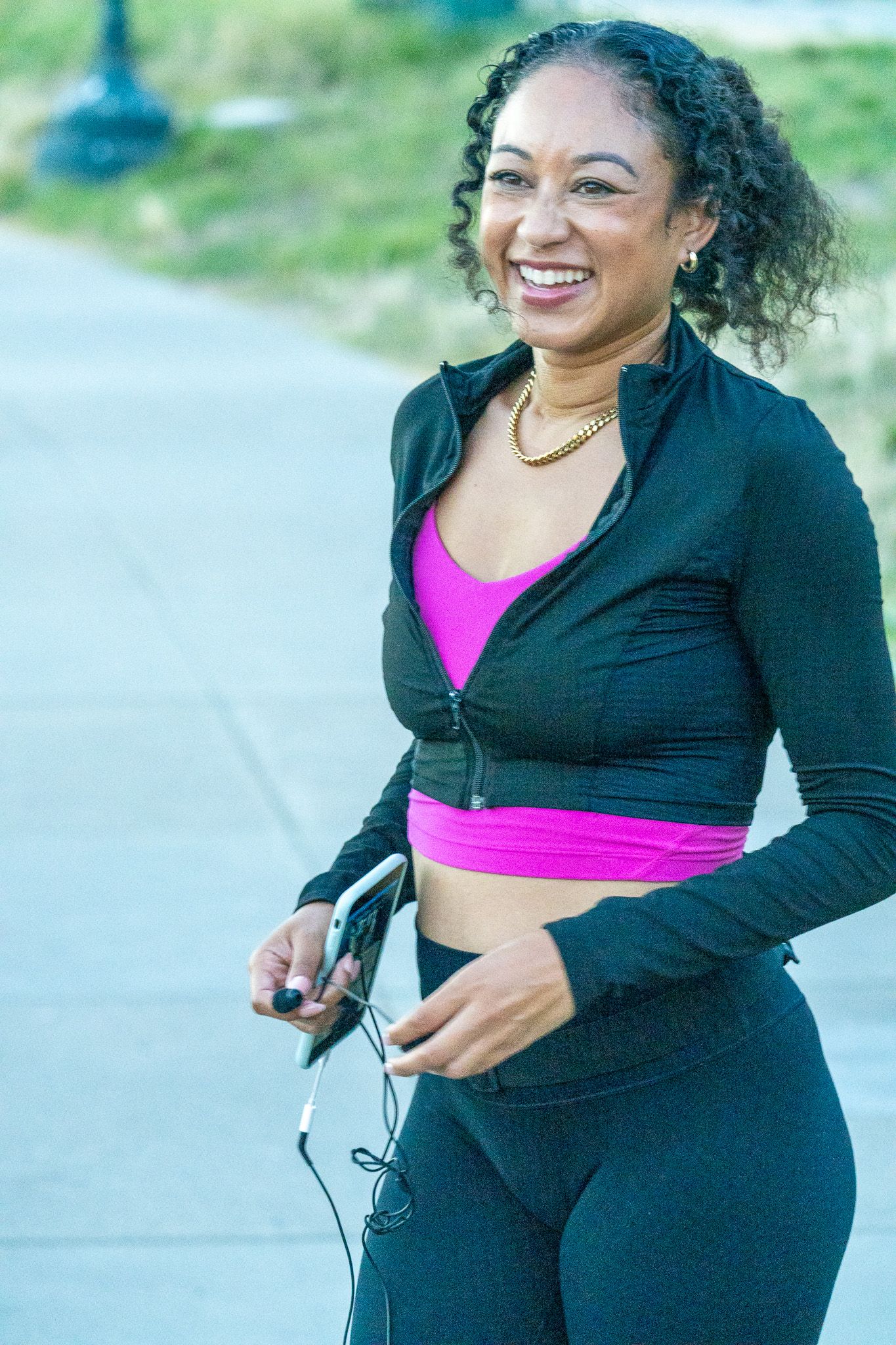Exercise session outdoors on a paved pathway during sunset.