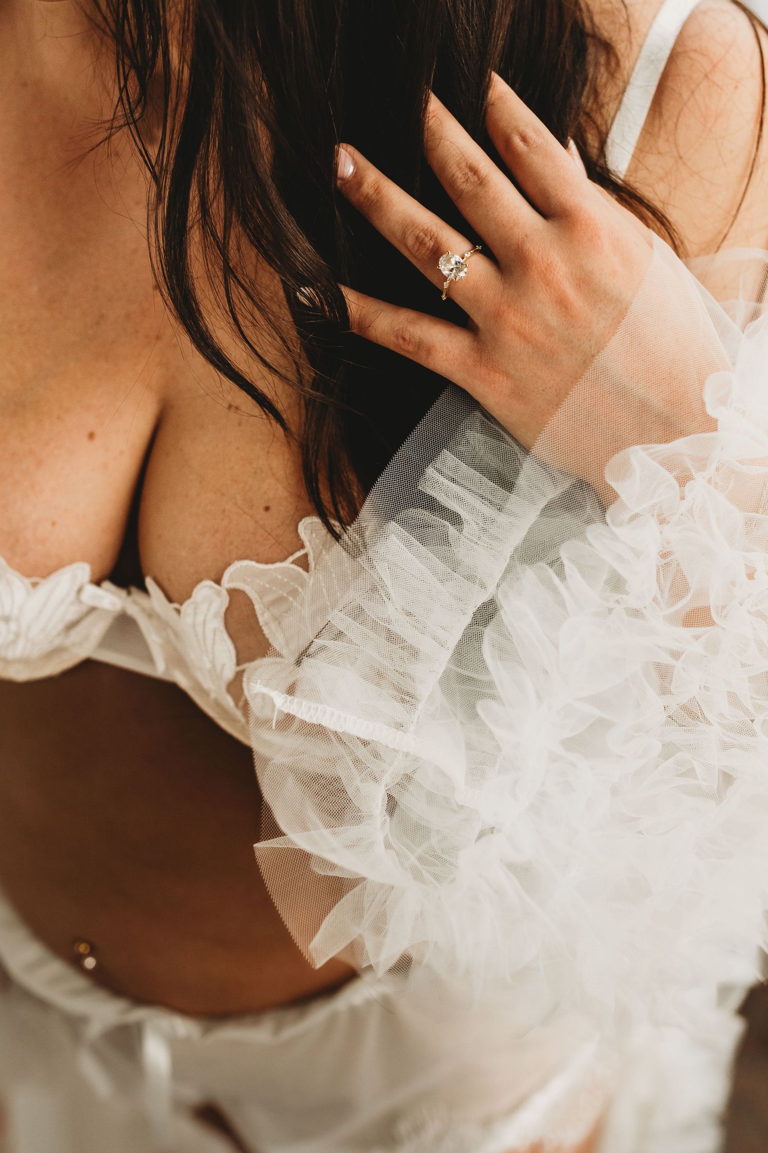 Charleston bridal boudoir close-up featuring white tulle and engagement ring — romantic, graceful, and timeless.