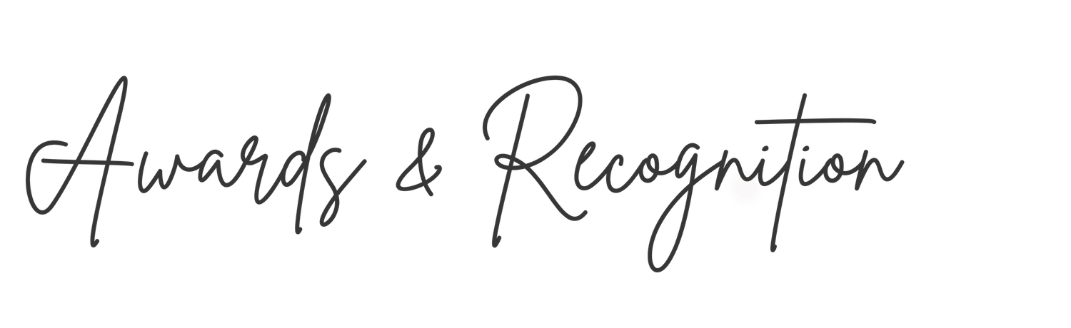 Elegant cursive script text reading Awards & Recognition on a white background.