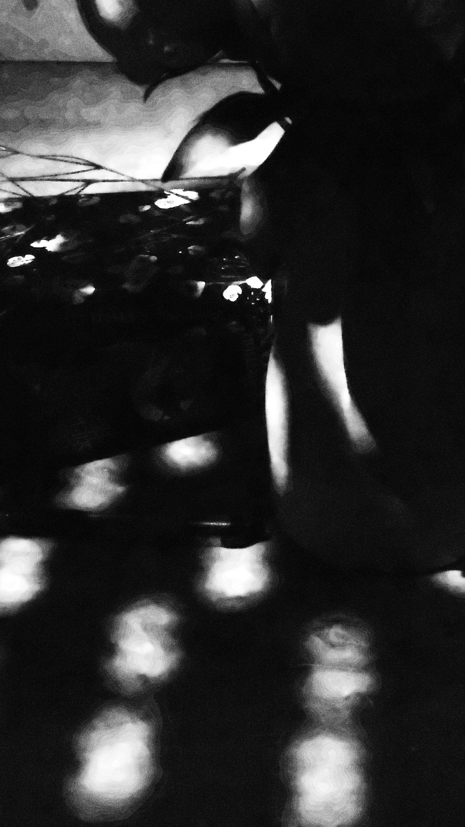 Abstract black and white image showing dramatic contrasts of light and shadow creating an ethereal artistic effect.