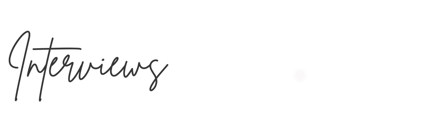Elegant cursive handwritten text reading Interviews in black ink on a white background.