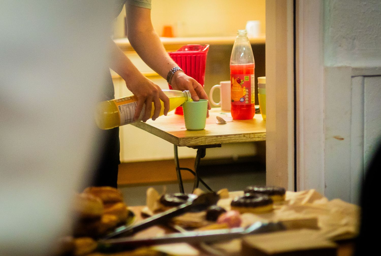 Food service setup with red containers visible in warm lighting.