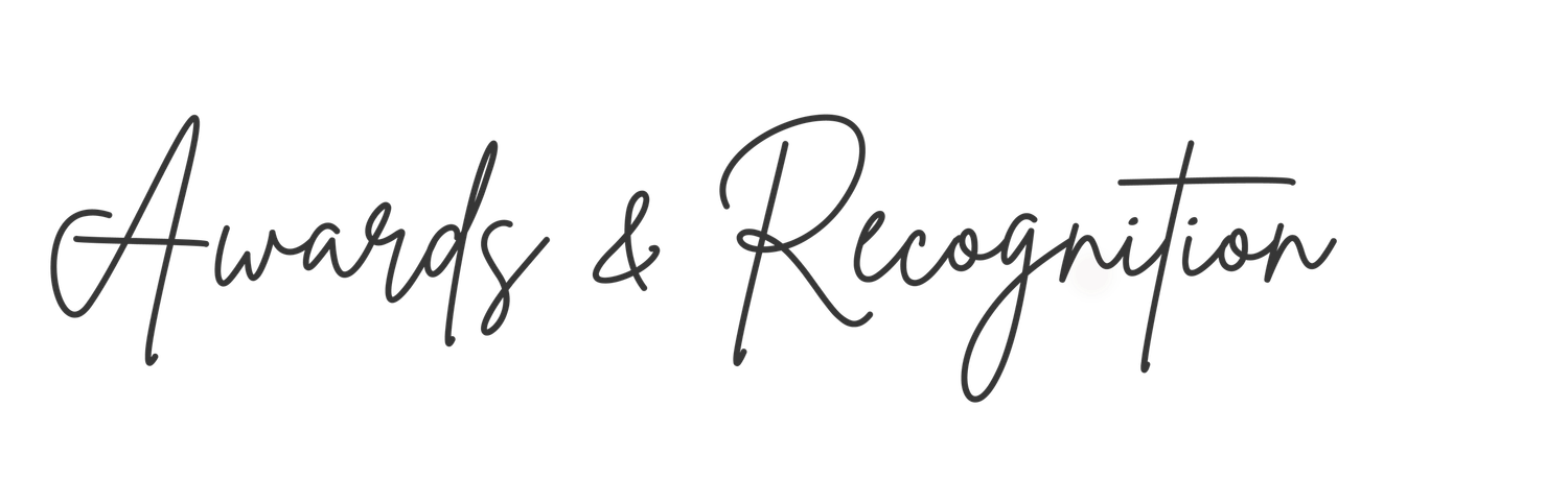 Elegant cursive script text reading Awards & Recognition on a white background.