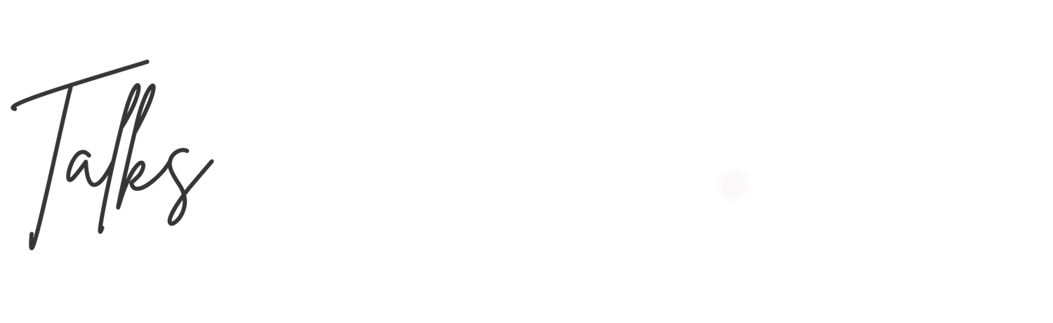 Elegant handwritten cursive script spelling Talks in black ink on a white background.