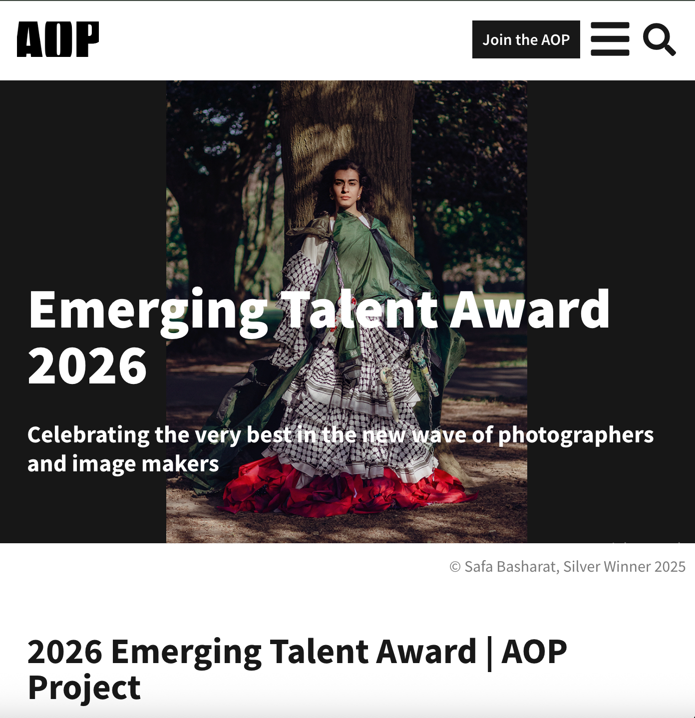 Photographer in a flamenco-inspired gown poses outdoors for the AOP Emerging Talent Award 2026.