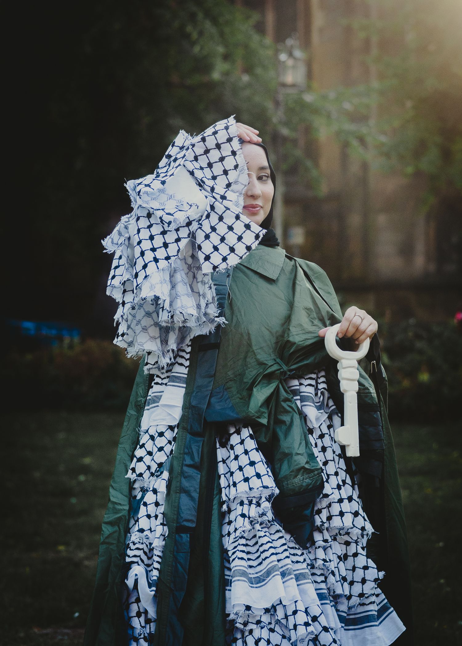 Dancing figure in green shirt and checkered scarf creates flowing motion through multiple exposure photography.
