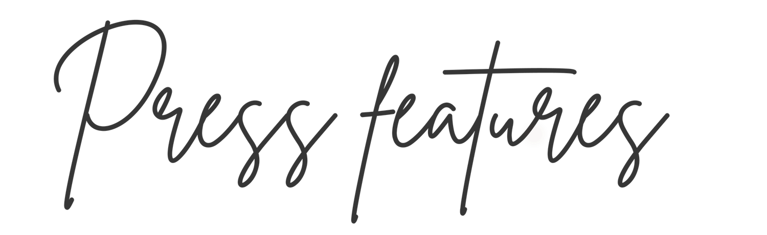 Elegant handwritten cursive script reading Press Features on a white background.