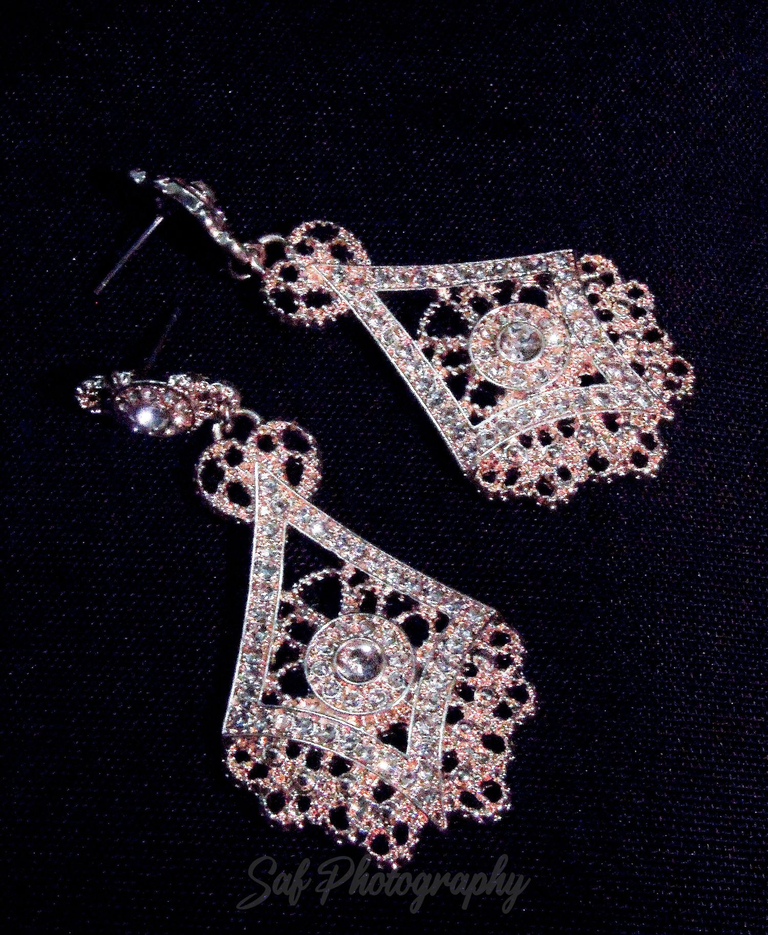 Close-up photos showing delicate pink rhinestone jewelry pieces sparkling against a black background.
