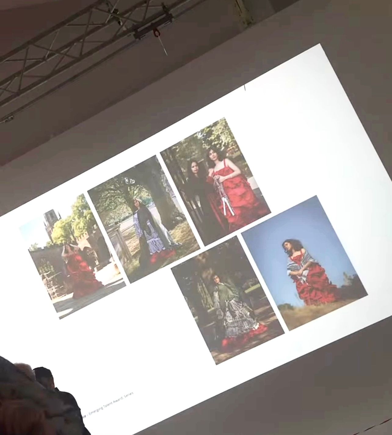 A collection of five fashion photographs displayed on a white screen or projection showing various outdoor poses and red outfits.
