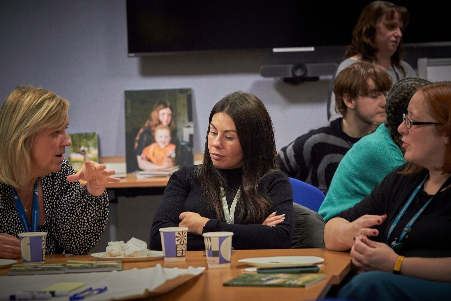 Teachers collaborate and engage in professional development activities during education workshop sessions.
