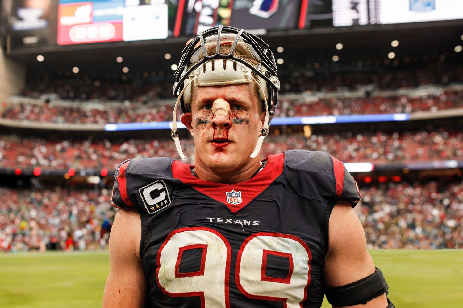 NFL players on the field show intensity during a football game.